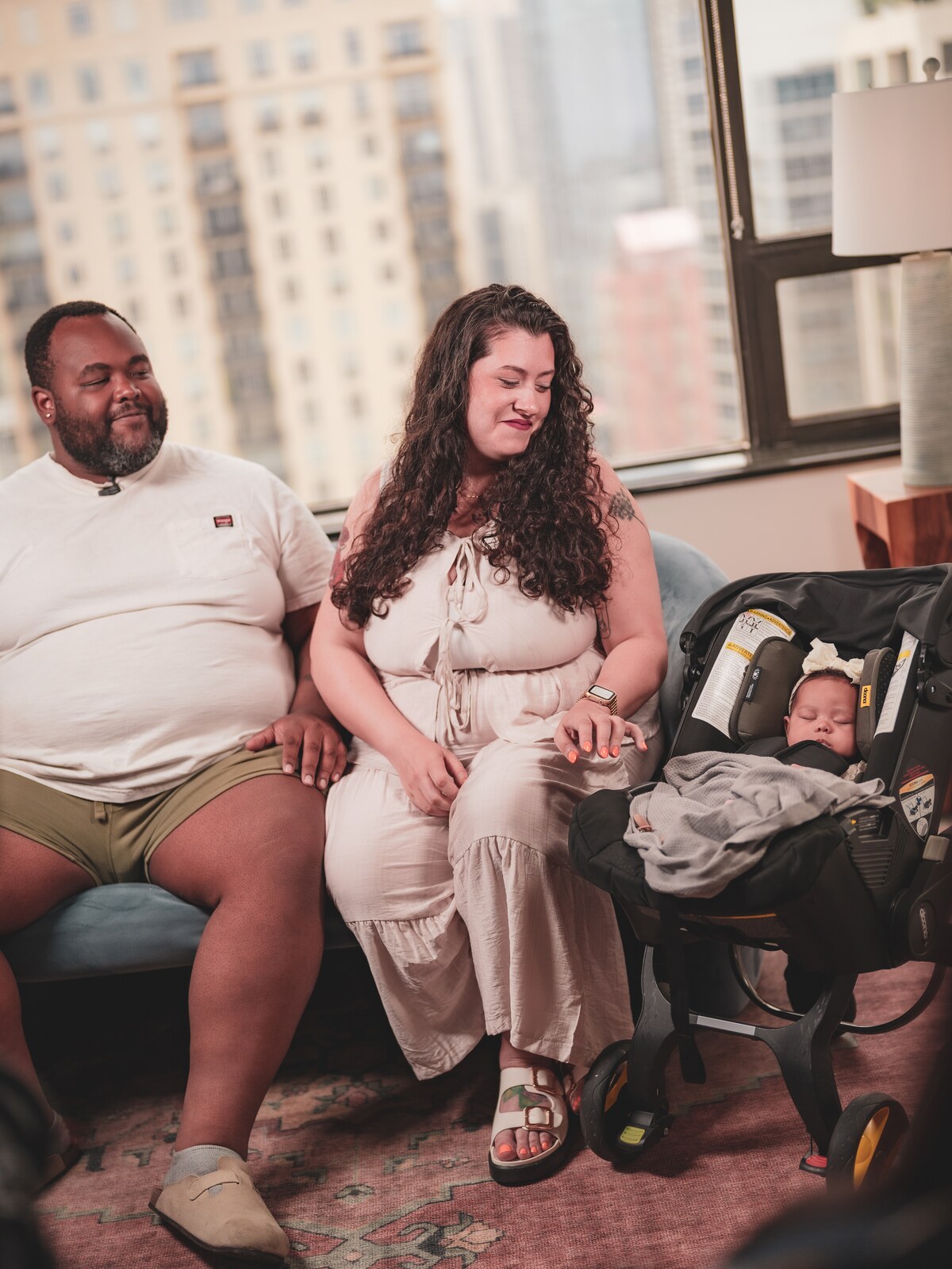 Parents with their newborn in a stroller